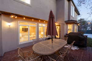 Wooden deck featuring grilling area