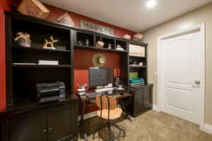 View of carpeted home office