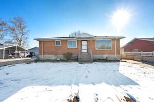 View of snow covered rear of property