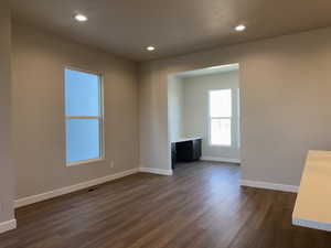 Spare room with dark hardwood / wood-style floors