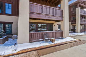 View of snow covered property entrance