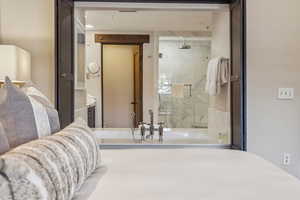 Bathroom with vanity and a shower with shower door