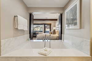 Bathroom featuring sink and a bathtub