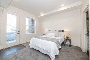 Carpeted bedroom featuring access to outside