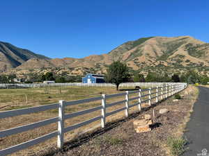 Property view of mountains with a rural view