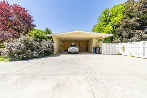 View of vehicle parking with a carport