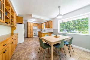 Dining space with sink and a textured ceiling