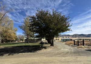 View of road with a rural view and a mountain view