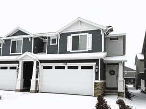 View of front of property with a garage