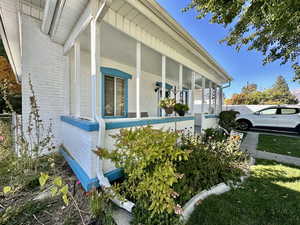 View of property exterior with covered porch