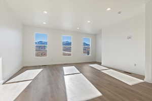 Unfurnished room featuring hardwood / wood-style flooring