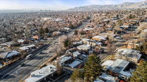 Birds eye view of property with a mountain view