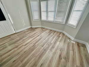 Unfurnished bedroom with light hardwood / wood-style floors