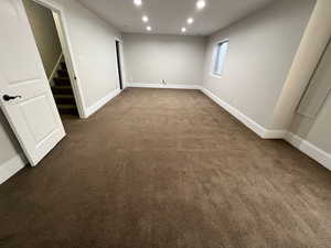 Spare room with dark carpet