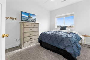 Bedroom with carpet flooring and ceiling fan