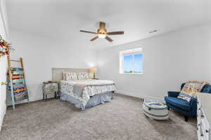 Bedroom featuring carpet and ceiling fan