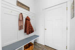 Mudroom with dark wood-type flooring