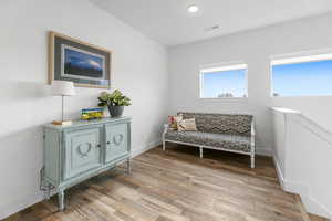 Sitting room with hardwood / wood-style floors