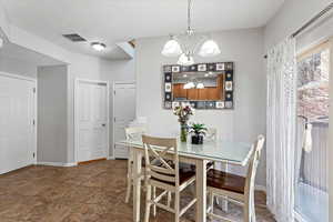 Dining area with an inviting chandelier