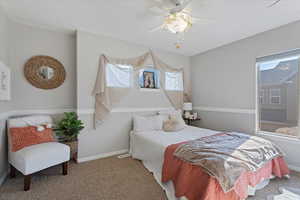 Bedroom with carpet and ceiling fan