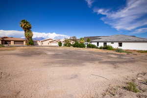 View of yard with a garage