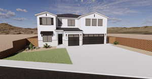 View of front of house with a mountain view, a garage, and a front yard