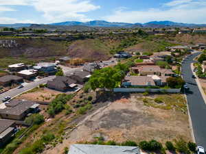 Birds eye view of property with a mountain view