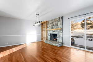 Beautiful fireplace and hardwood floors in your dining area.