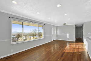 West facing living room with a large, gorgeous picture window to enjoy the view of the valley.