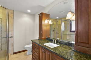 Beautiful ensuite primary bathroom with separate tub and shower.