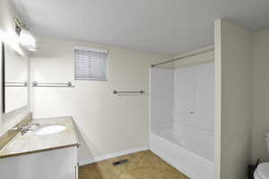 Full bathroom featuring vanity, shower / tub combination