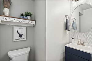 Bathroom with vanity and toilet