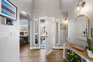 Entrance foyer with hardwood / wood-style floors