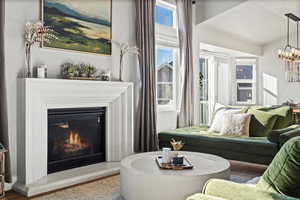 Living room featuring a notable chandelier