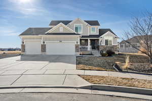 Craftsman-style house with a garage and covered porch