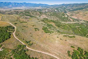 Birds eye view of property with a mountain view