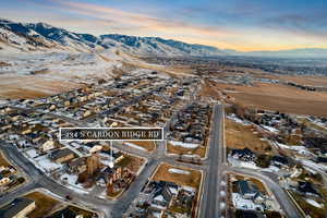 Snowy aerial view featuring a mountain view