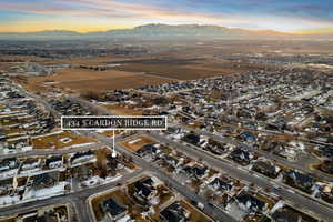 Aerial view at dusk featuring a mountain view