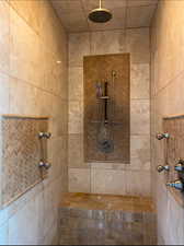 Master Bathroom featuring a tile shower