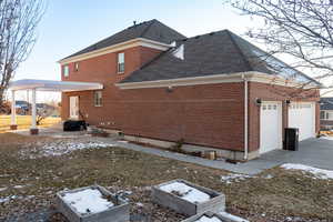 Snow covered property featuring a garage