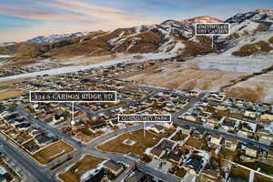 Snowy aerial view featuring a mountain view