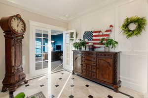 Interior space featuring crown molding and french doors