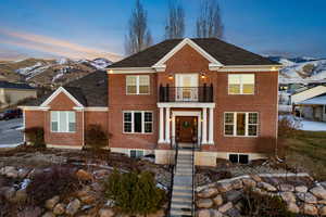 View of front facade with a balcony and a mountain view