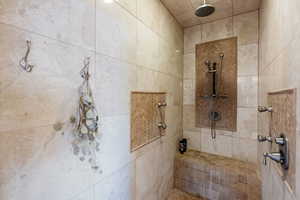 Master Bathroom featuring a tile shower