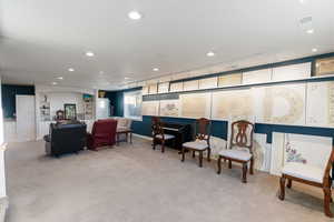 Family room featuring light carpet, track lighting