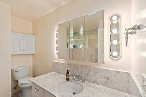 Bathroom with vanity and toilet