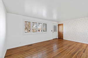 Unfurnished room featuring hardwood / wood-style flooring