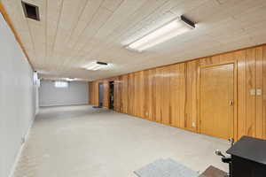 Basement with wooden walls and wooden ceiling