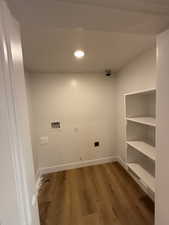 Laundry area with hookup for a washing machine and wood-type flooring