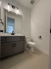 Bathroom with vanity and toilet